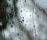 Imagem da chuva escorrendo pelo vidro de uma janela